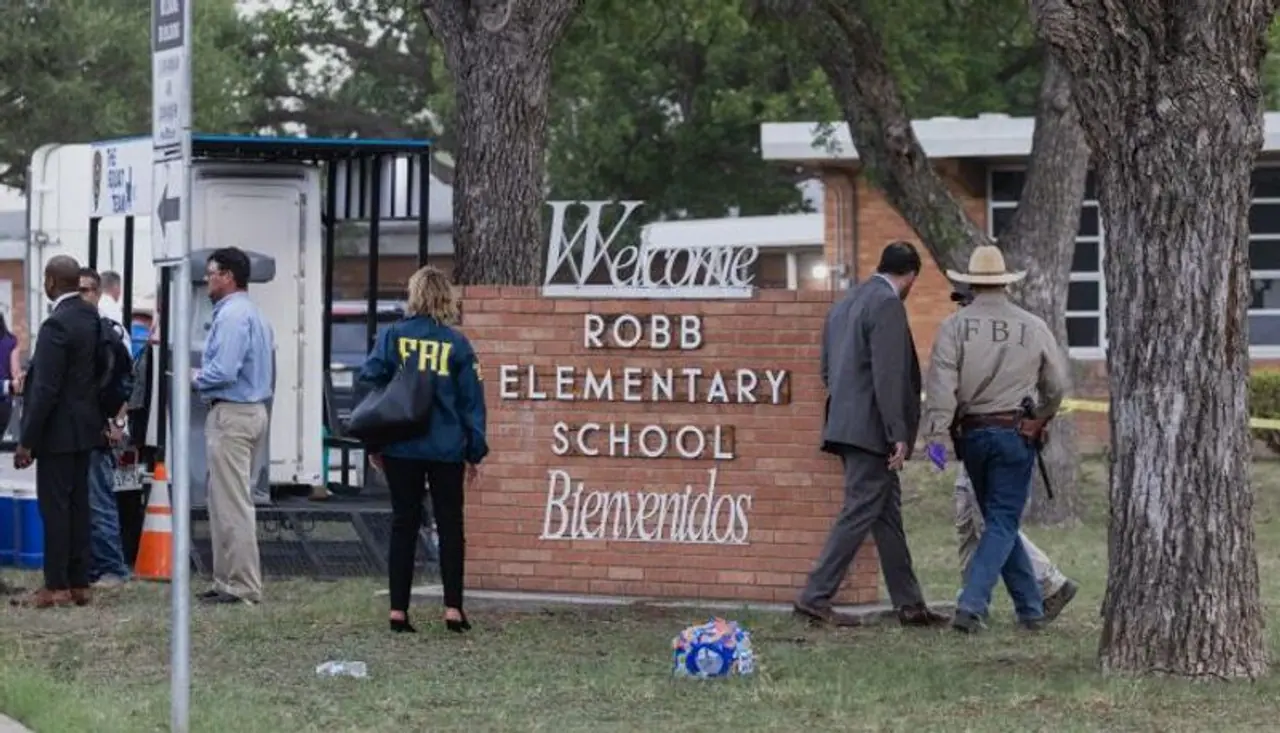 <I>Image: Law enforcement work the scene after a mass shooting at Robb Elementary School where 19 people, including 18 children, were killed on May 24, 2022 in Uvalde, Texas. Photograph: Jordan Vonderhaar/Getty Images</I> <I>Image: Law enforcement work the scene after a mass shooting at Robb Elementary School where 19 people, including 18 children, were killed on May 24, 2022 in Uvalde, Texas. Photograph: Jordan Vonderhaar/Getty Images</I>