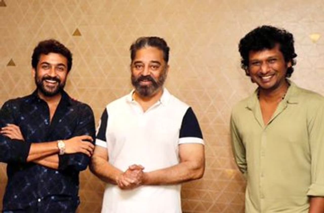 kamal haasan gifts a watch to suriya kamal haasan gifts a watch to suriya