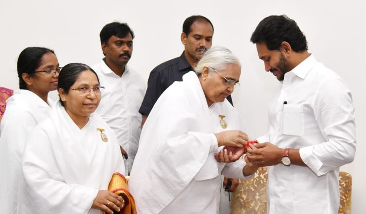 women ministers, party leaders and brahma kumaris tie rakhis to cm ys jagan women ministers, party leaders and brahma kumaris tie rakhis to cm ys jagan