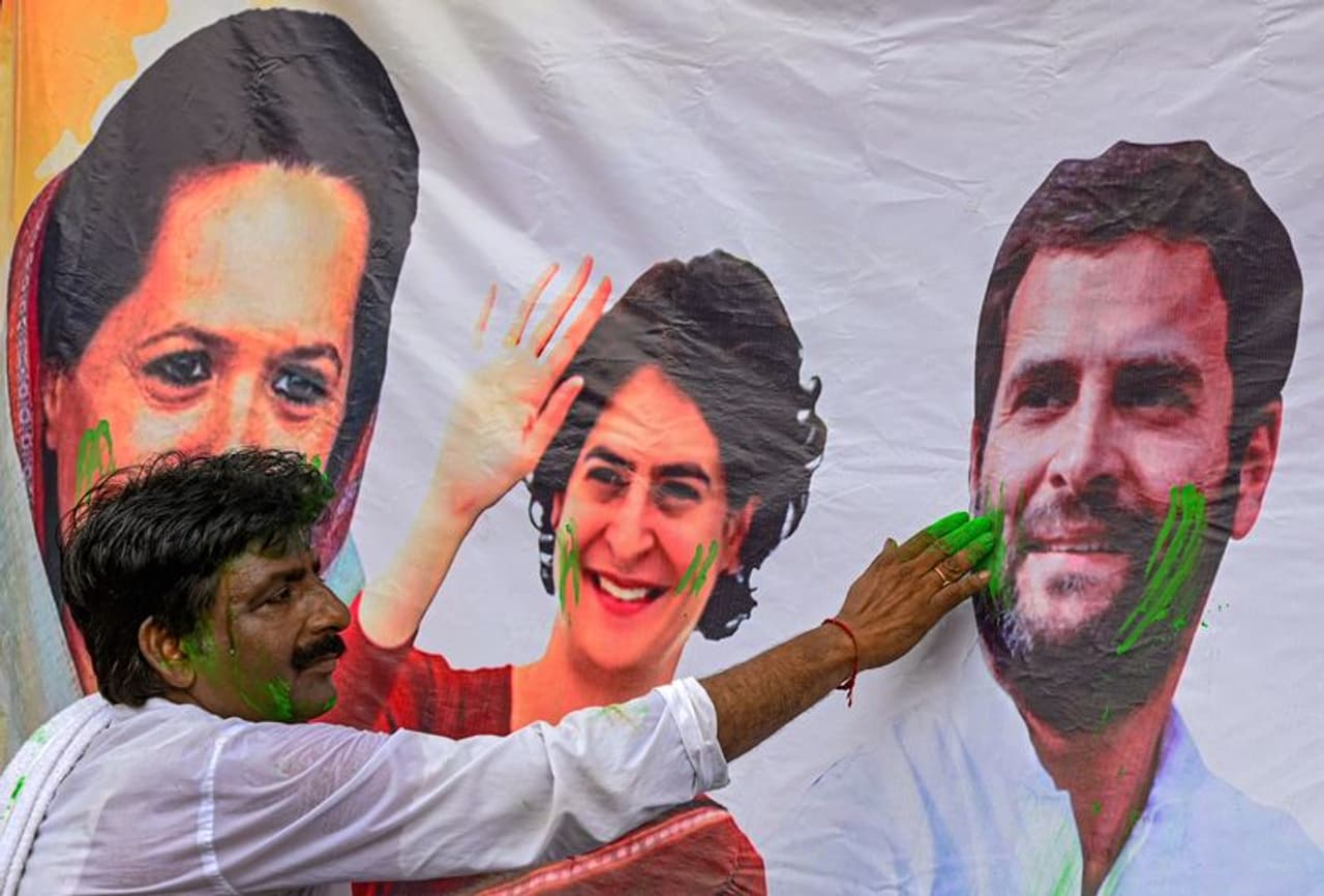 <I>Image: A Congress worker celebrates party's win in the Karnataka Assembly elections, in Kolkata, Saturday, May 13, 2023. Photograph: PTI Photo</I>