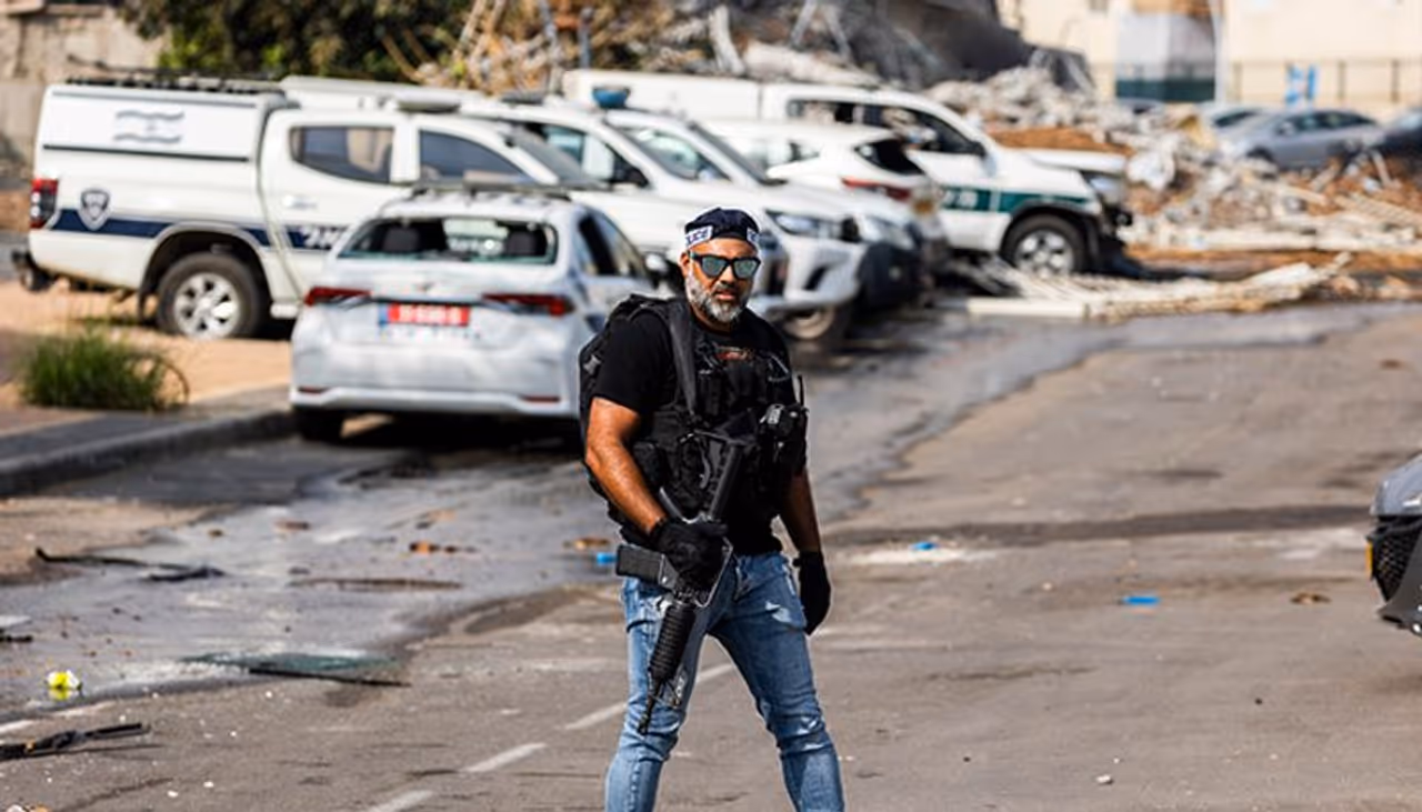 <I>Image: A policeman stands after the deadly attack on a police station in the city of Sderot on the second day of the ongoing conflict between Israel and the Palestinian militant group Hamas. Photograph: Ilia Yefimovich/picture alliance via Getty Images</I> <I>Image: A policeman stands after the deadly attack on a police station in the city of Sderot on the second day of the ongoing conflict between Israel and the Palestinian militant group Hamas. Photograph: Ilia Yefimovich/picture alliance via Getty Images</I>