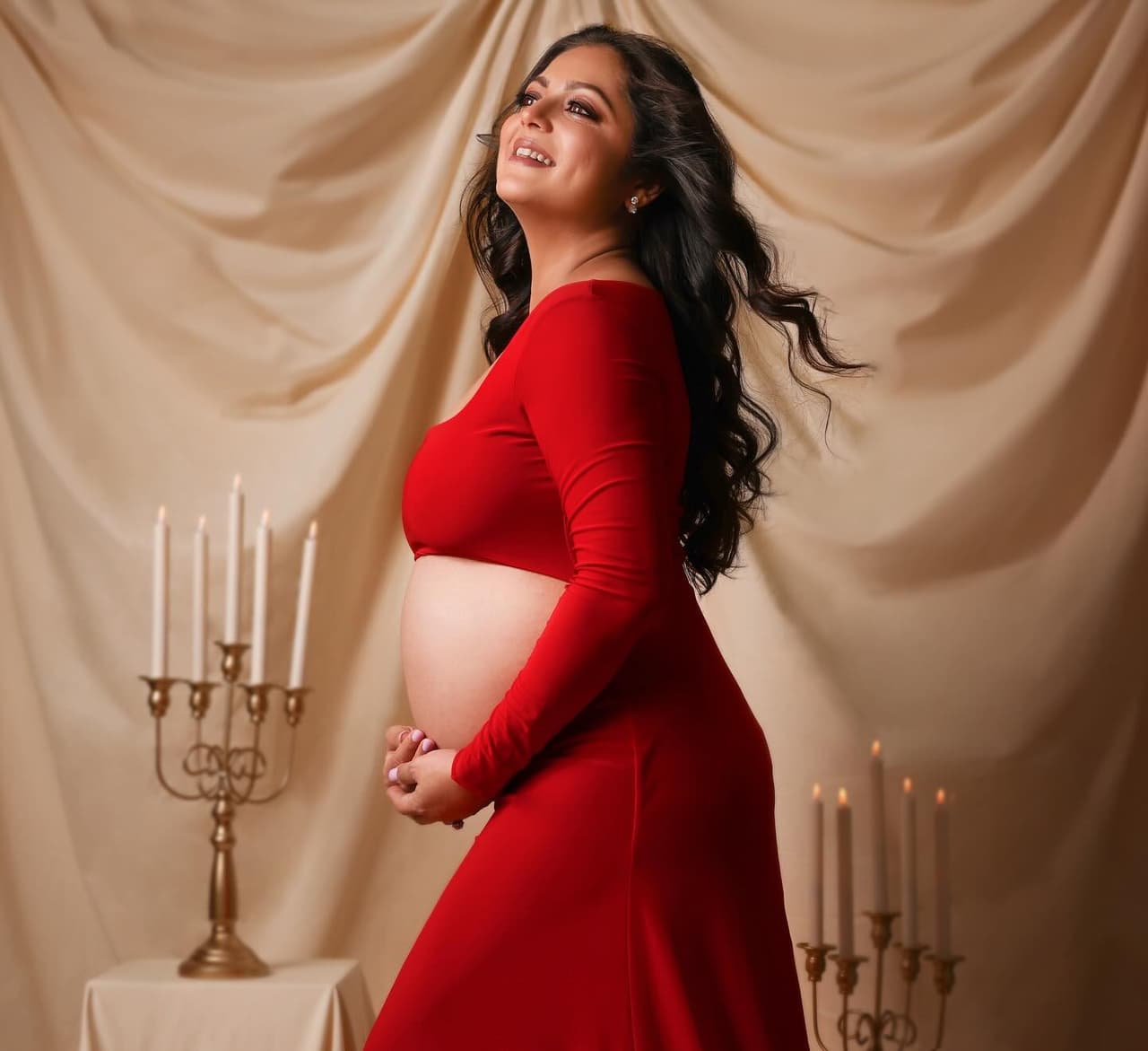 Drashti Dhami flaunts baby bump in red dress.