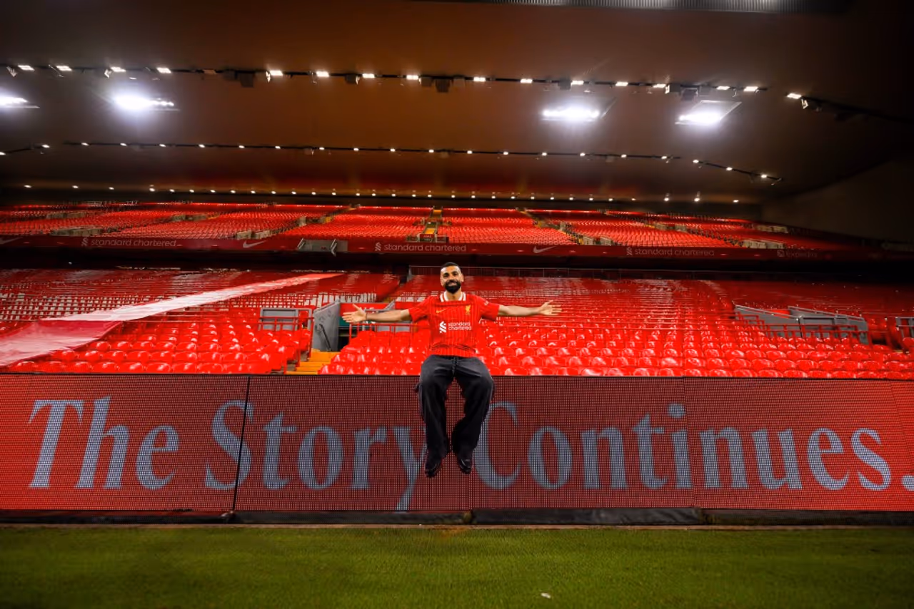 Salah signs new Liverpool contract Salah signs new Liverpool contract