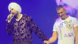 Diljit Dosanjh’s Humble Gesture Wins Hearts as He Corrects Fan Over ‘Ik Onkar’ T-Shirt - WATCH