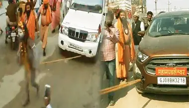 देखिए कुंभ मेले में कैसे खिंची नागा साधु ने गाड़ियां (वीडियो)