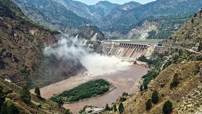 The gates of the Salal Dam open as the Chenab river swells up due to heavy rainfall