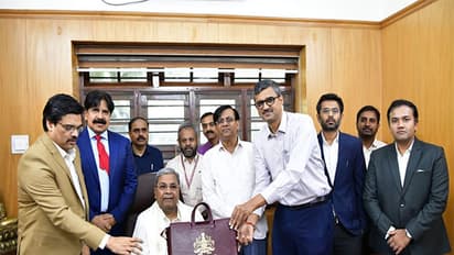 Karnataka CM Siddaramaiah with Budget document (Photo/ANI) Karnataka CM Siddaramaiah with Budget document (Photo/ANI)