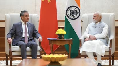 Wang Yi meets PM Narendra Modi