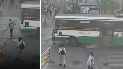 Vijayawada man crushed under APSRTC bus while crossing road CCTV shows pedestrian fatally hit while taking out phone