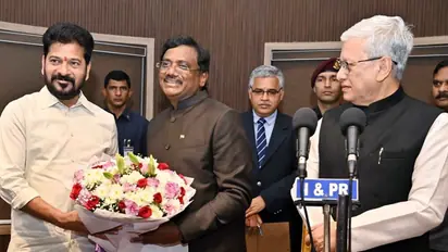 Revanth Reddy congratulates the newly sworn-in Telangana cabinet minister, Vivek Venkata Swamy