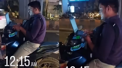 Man Works on Laptop While Riding Bike At 12:15AM