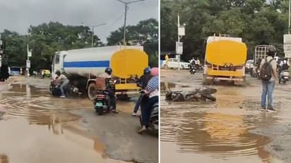 Bengaluru Viral Video: Biker Cheats Death as Tanker Crushes His Two-Wheeler on Pothole-Ridden Road (WATCH)