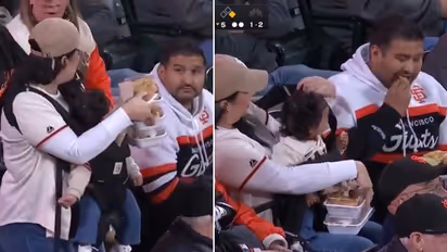 Woman Carries Baby And 3 Plates Of Food While Man Beside Her Just Watches; Video Goes Viral (WATCH)