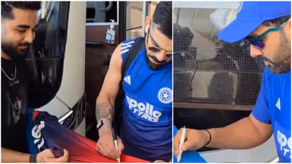 rohit and virat giving autographs