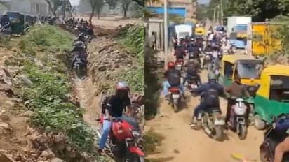 Bikers take muddy shortcuts on Bengaluru’s Panathur Road to escape traffic jam
