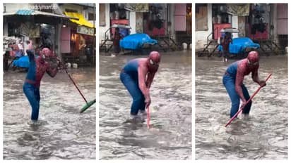 Spider man try to clean waterlogged mumbai streets 