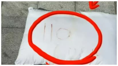 pillow written with 110 in blood
