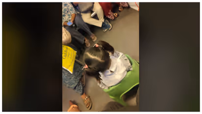 girl arrived at her own seat in the Delhi Metro