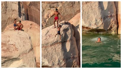 father threw his 7 year old son from a rock into the water