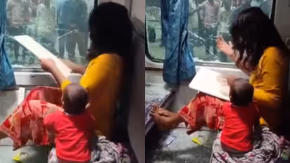 distressed-woman breaks train window 