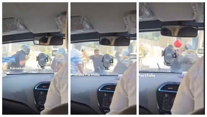 men fighting each other with helmets in road