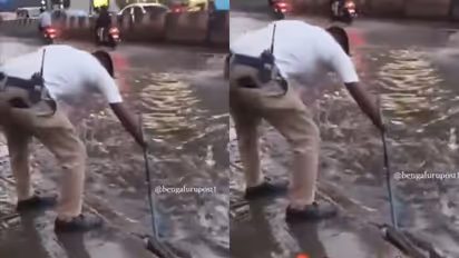 Bengaluru Traffic Police clearing waterlogged roads during rains