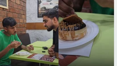 Content creator treats waiter to his first doughnut in viral video
