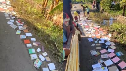 Schoolchildren Dry their Textbooks After Assam Floods