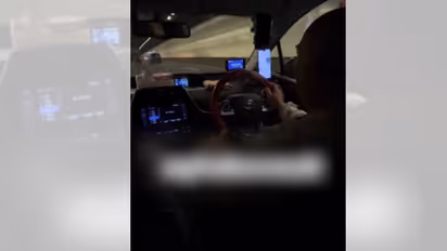 Singapore Driver Caught Texting While Driving by Female Passenger