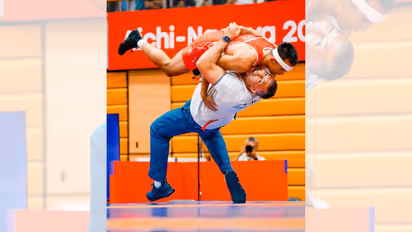 Aytjan Khalmakhanov and his Coach
