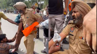 Punjab Police ASI Sehajpreet Singh surrounded by locals in Budhlada