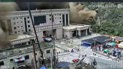 Beijing warned risk from barrier lake upstream from the Himalayan border crossing that could complicate rescue efforts