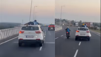 Cop Climbs Onto Car Roof During 40KM Chase