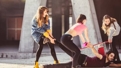 Girls kicked and punched a boy on the road