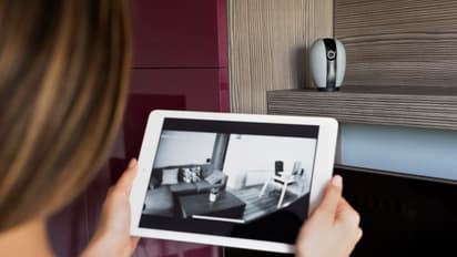 woman checking security camera