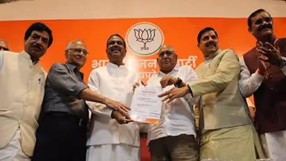 Hemant Khandelwal holding certificate of party president in the middle 