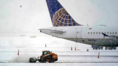 us winter storm flight cancellations holiday travel airlines weather alert