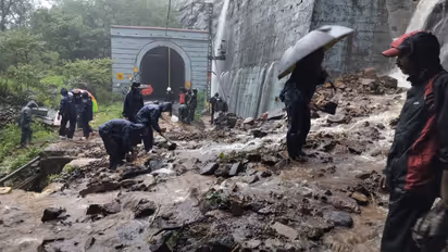 mumbai heavy rainfall landslide deaths imd red alert mumbai pune train disruption school closure