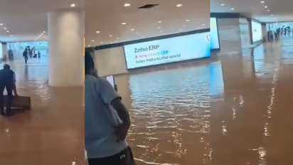 noida airport waterlogging rain terminal parking flight cancelled indigo