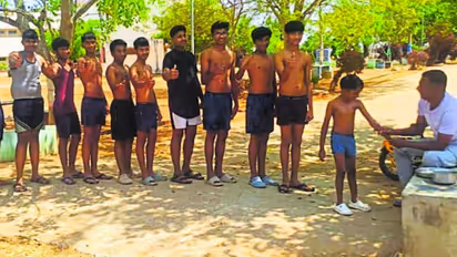 Heart Warming Gesture Karnataka Teacher Performs Abhyanjana Snana for Students on Ugadi