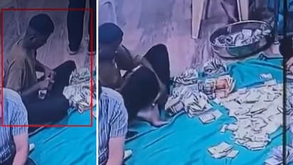Ambaji Temple cash theft CCTV clip of worker hiding notes under foot goes viral Gujarat police files case against three