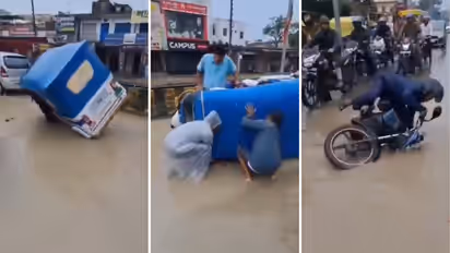 Varanasi Waterlogging Amid Heavy Rain Auto Bike Overturn On Flooded Road Video Goes Viral