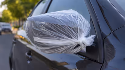 Tying a plastic bag to the car mirrors why it is recommended and what it is used for