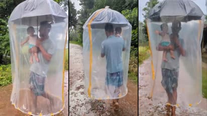 Monsoon viral video Father s Unusual Umbrella Hack To Protect Child From Rain Wins Hearts Online