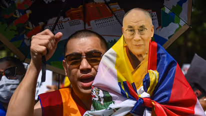 Dalai Lama cut out held during a protest by Tibetans (File Photo)