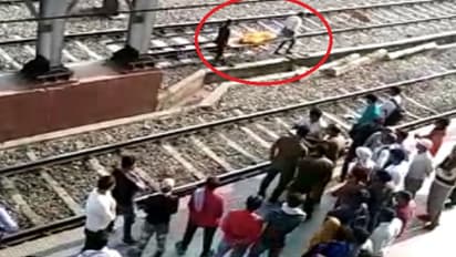 Girl jumps in front of train