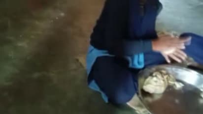 girl students making chapatis in hostel