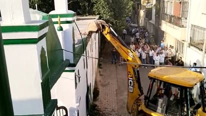 Bulldozer on mosque