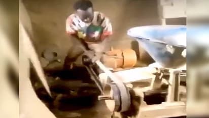 man challanging aata chakki