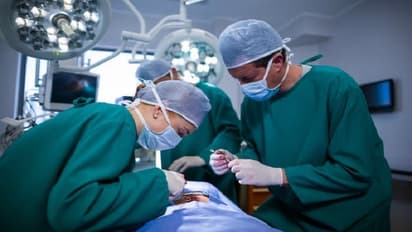 surgeons performing operation in operation theater